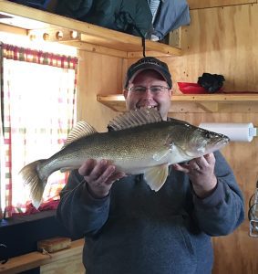man shows big caught fish
